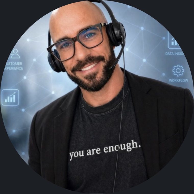 Portrait of Scott Sheffield wearing a headset and smiling